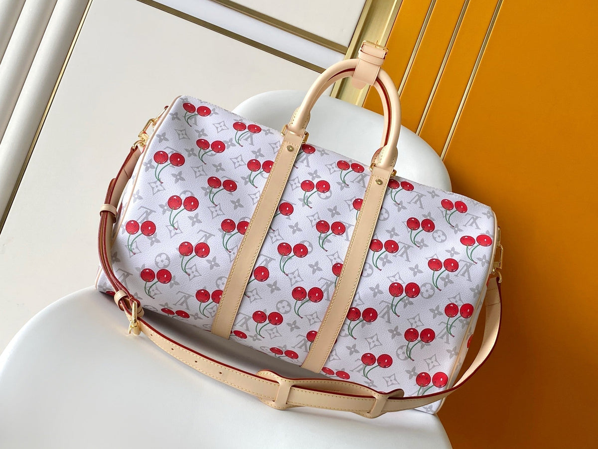 LOUIS VUITTON KEEPALL BANDOULIÈRE 45 IN WHITE AND RED CALFSKIN
